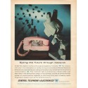1962 General Telephone & Electronics Ad "Eyeing the future"